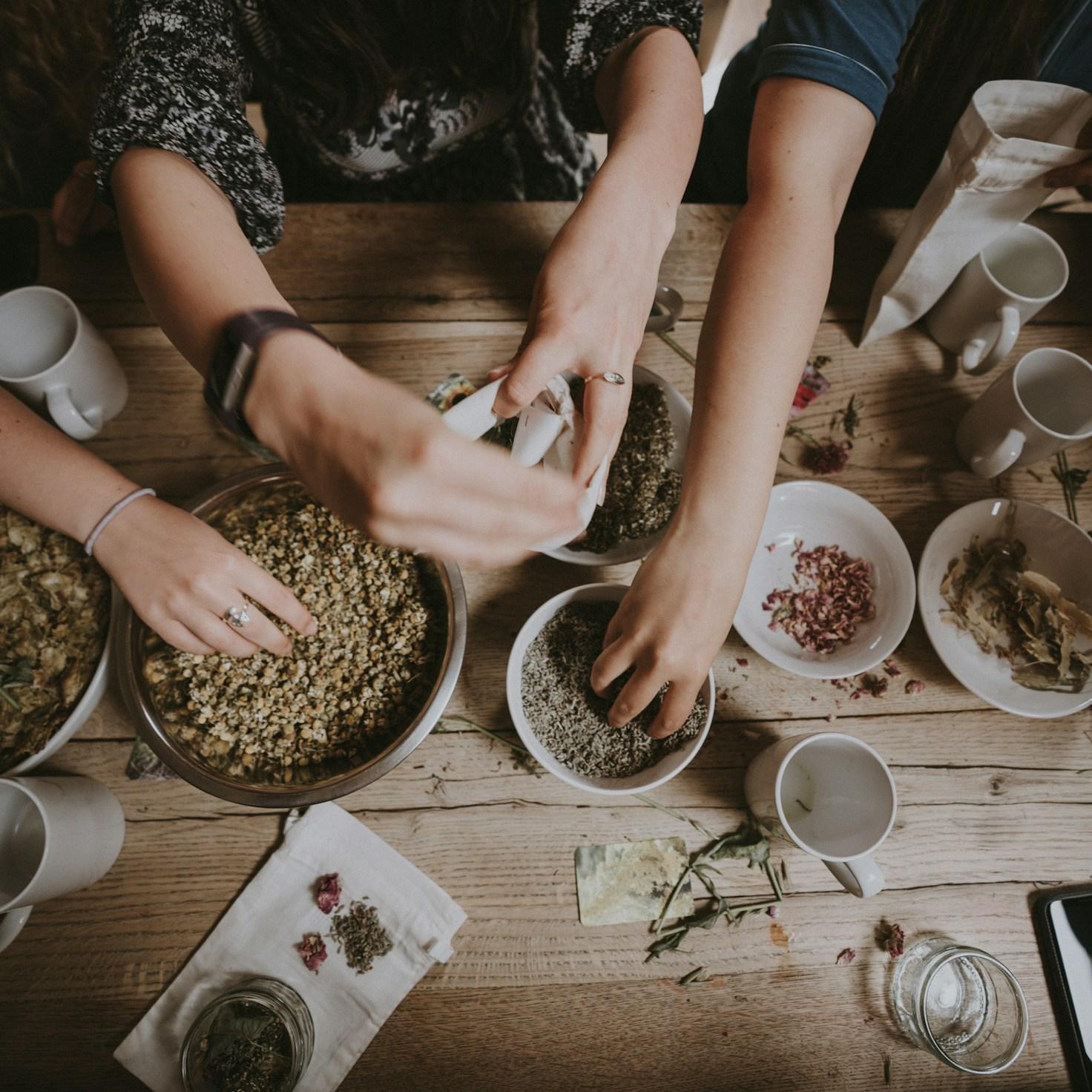Community members collaborating in a modern kitchen space, sharing recipes and cooking techniques